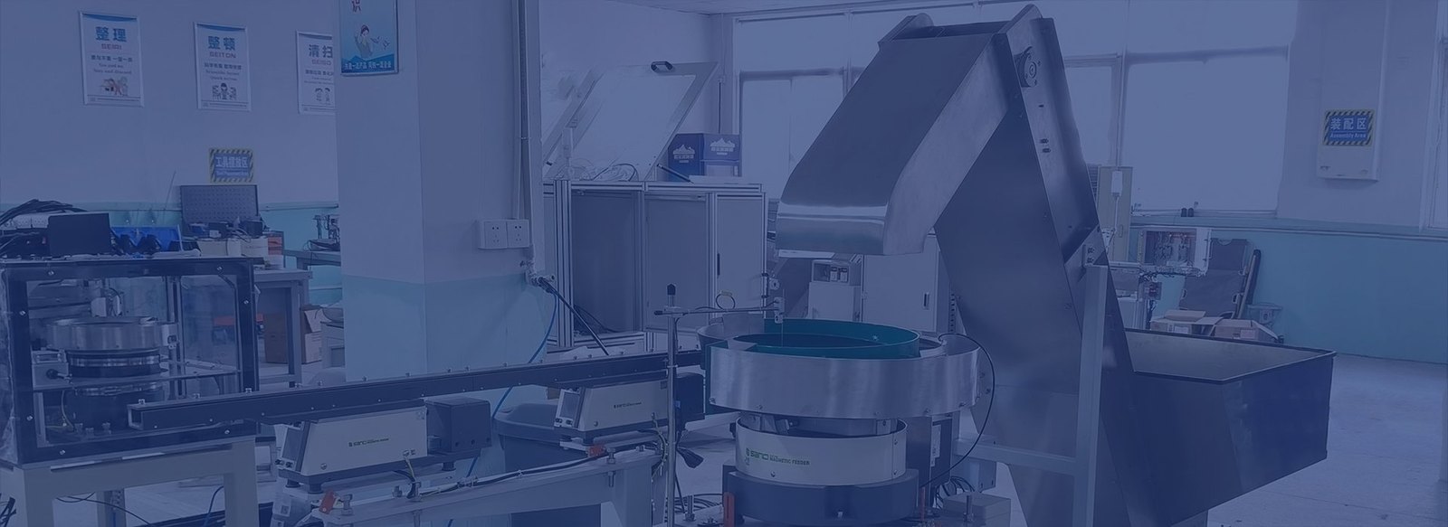 Integrated feeder, hopper and linear track system in a manufacturing facility